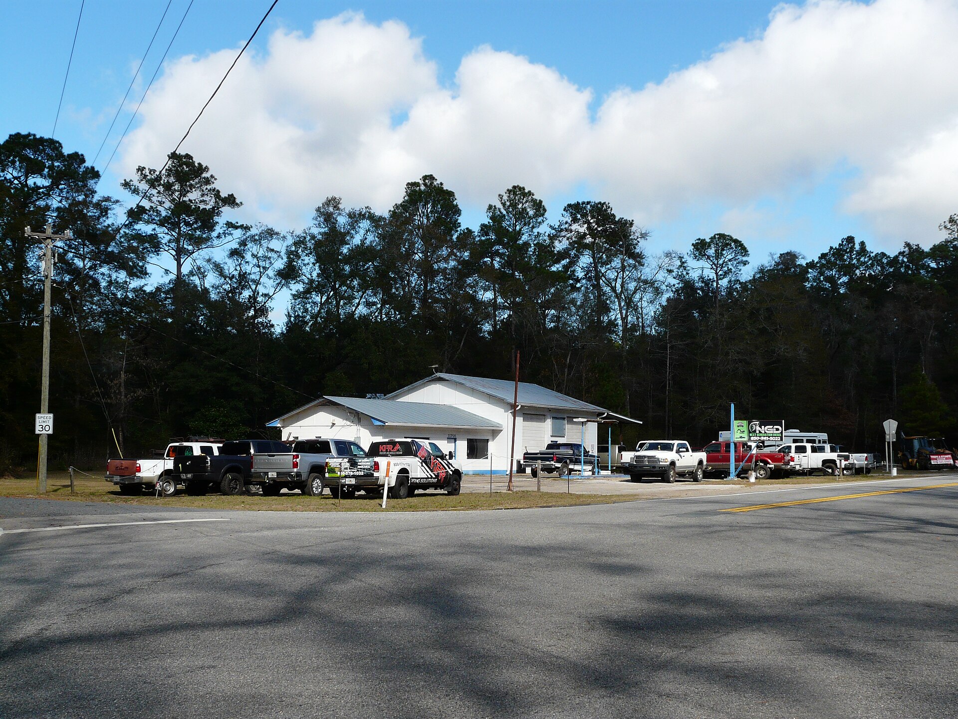 Repair yard with work trucks